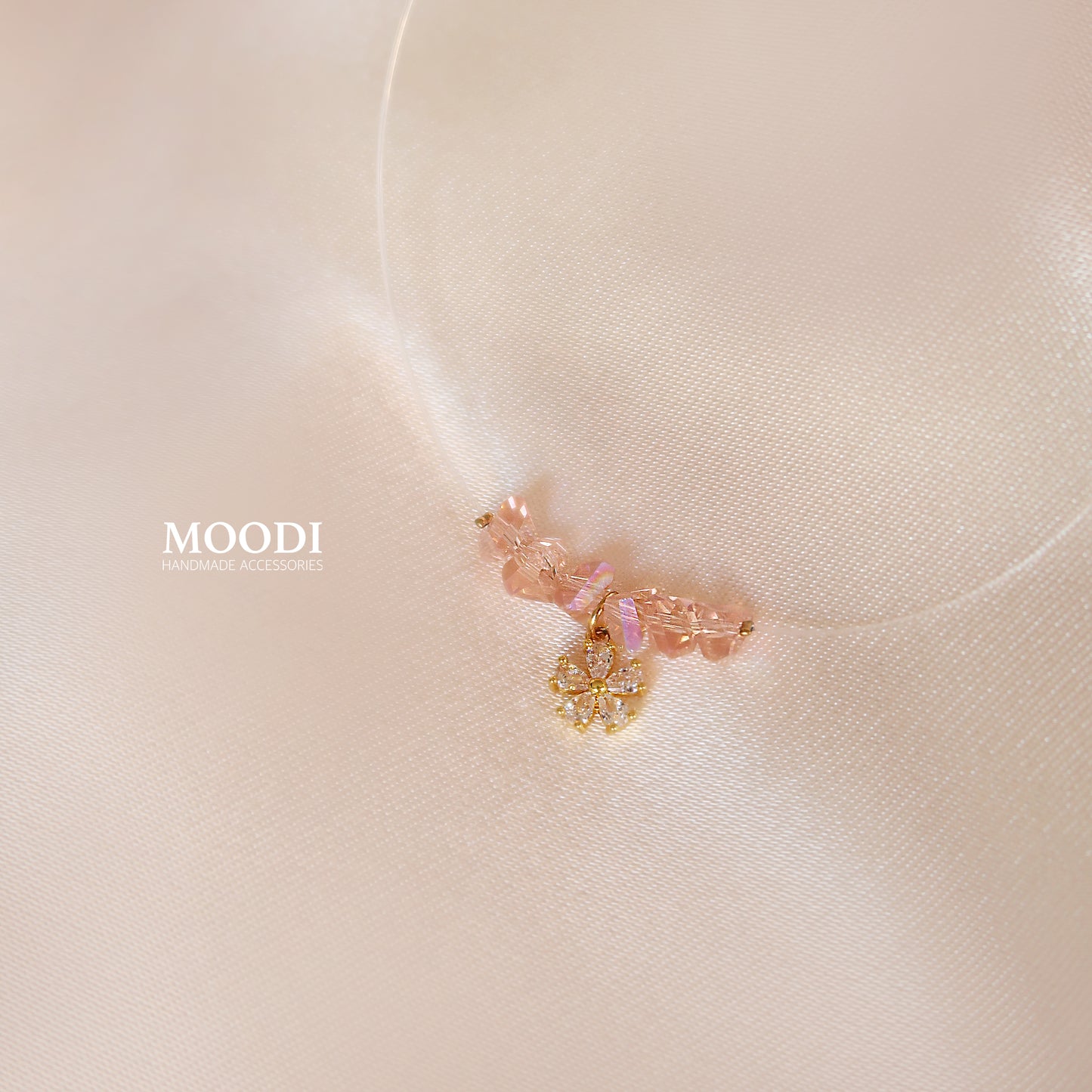 Flowers necklace on a transparent cord.