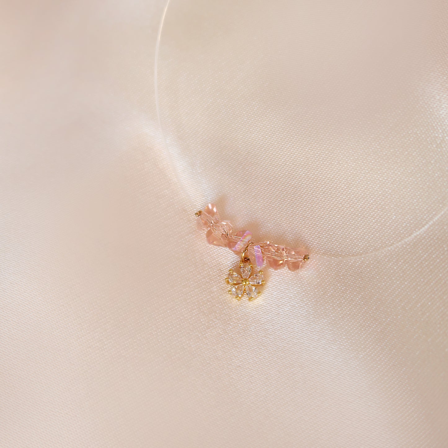 Flowers necklace on a transparent cord.