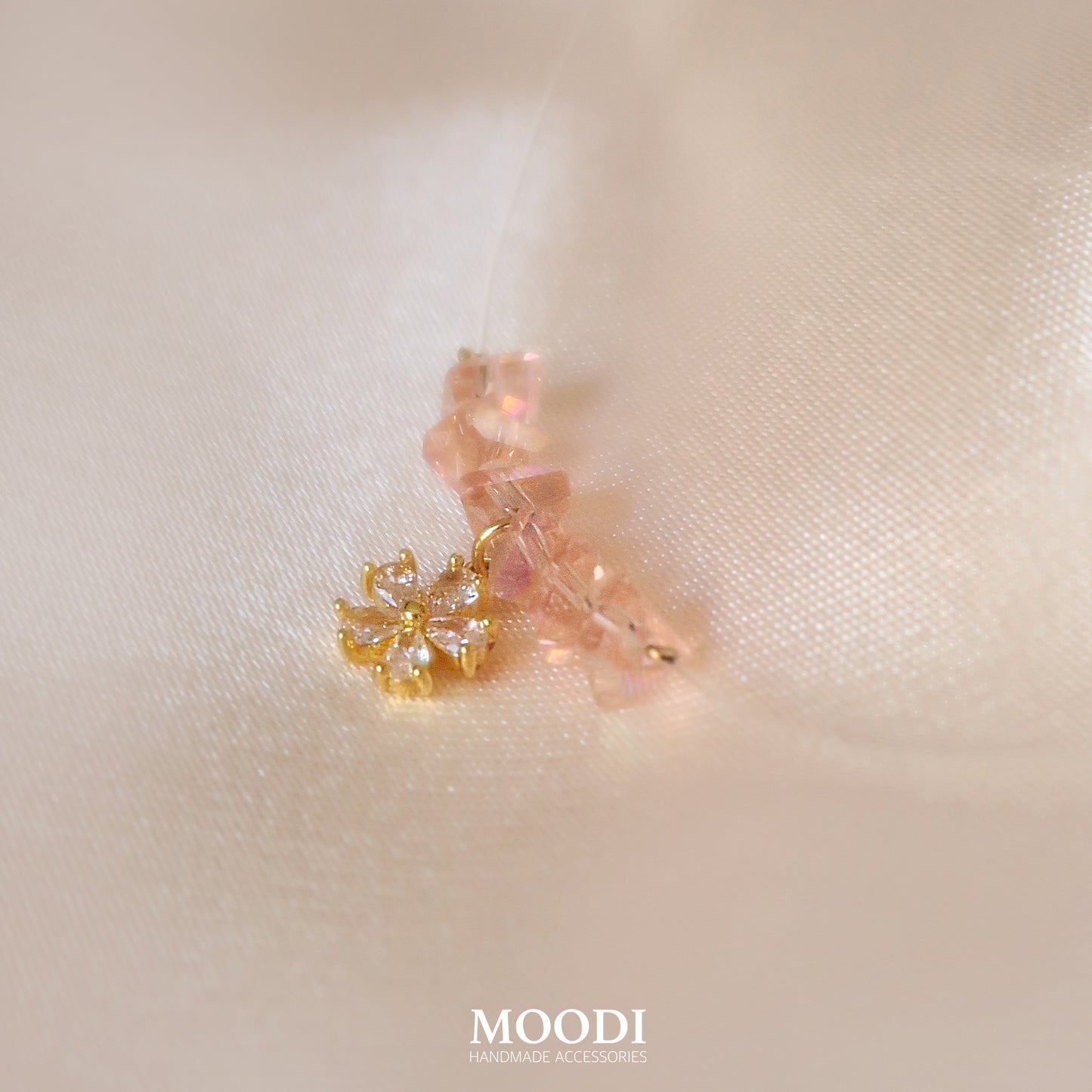 Flowers necklace on a transparent cord.
