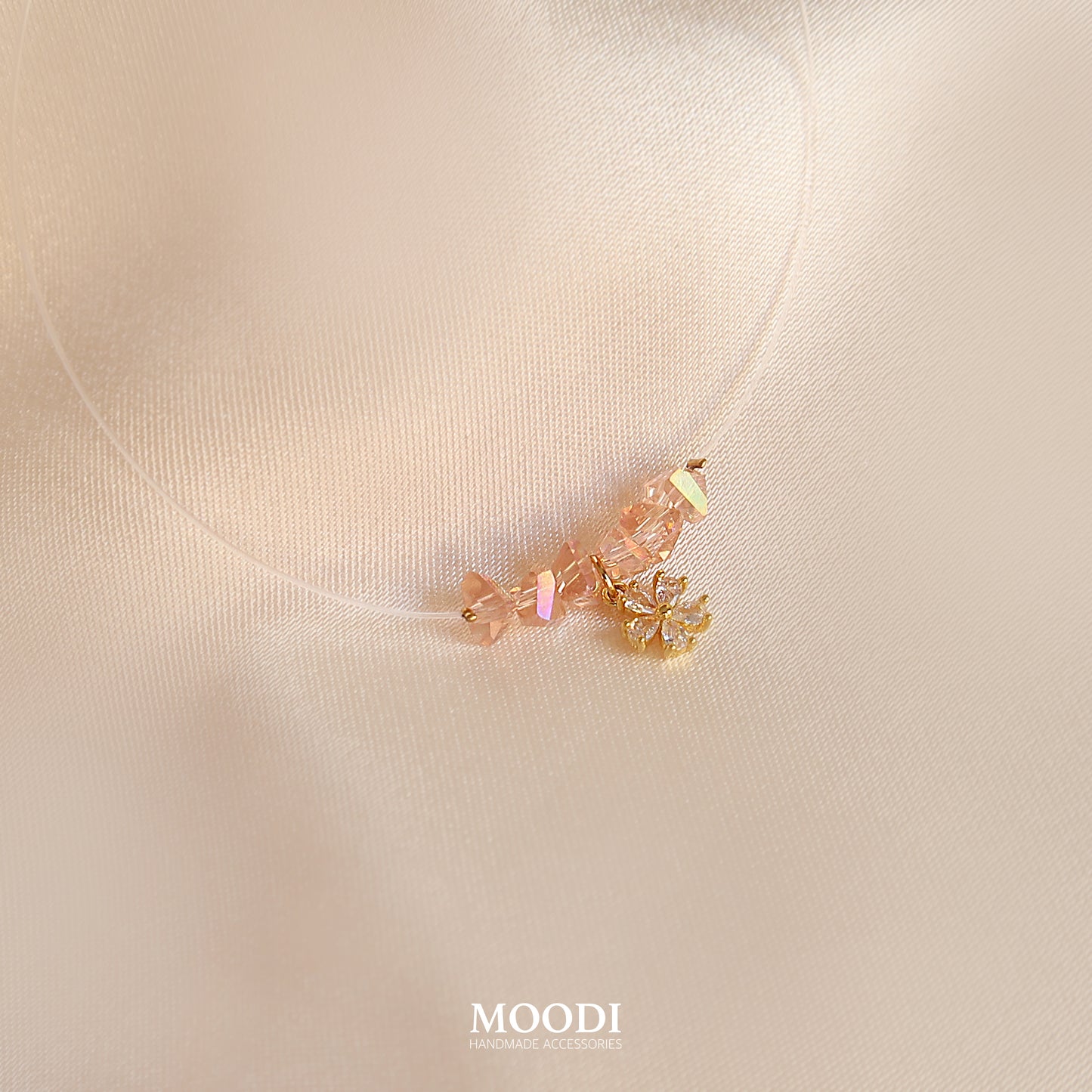 Flowers necklace on a transparent cord.