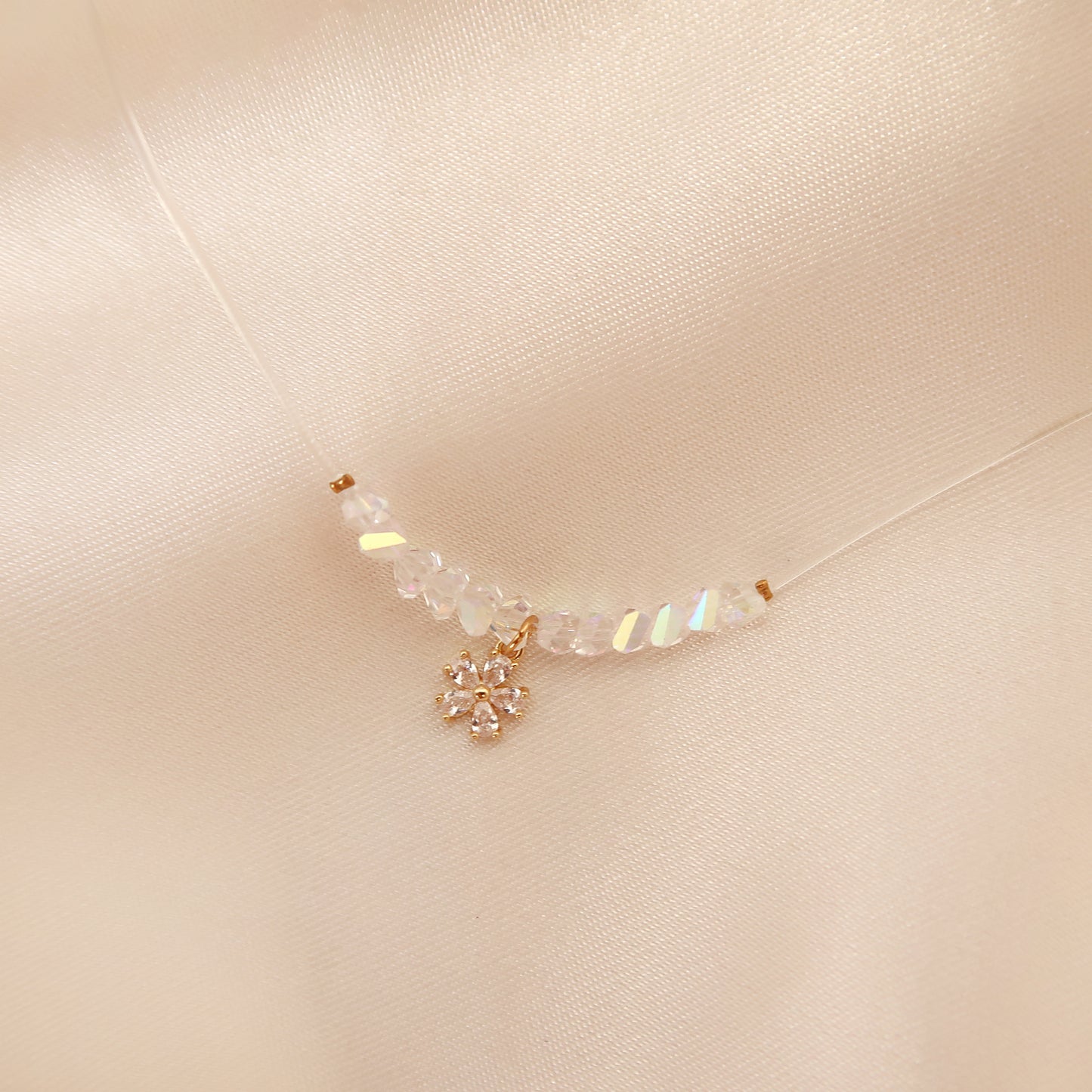 Flowers necklace on transparent cord