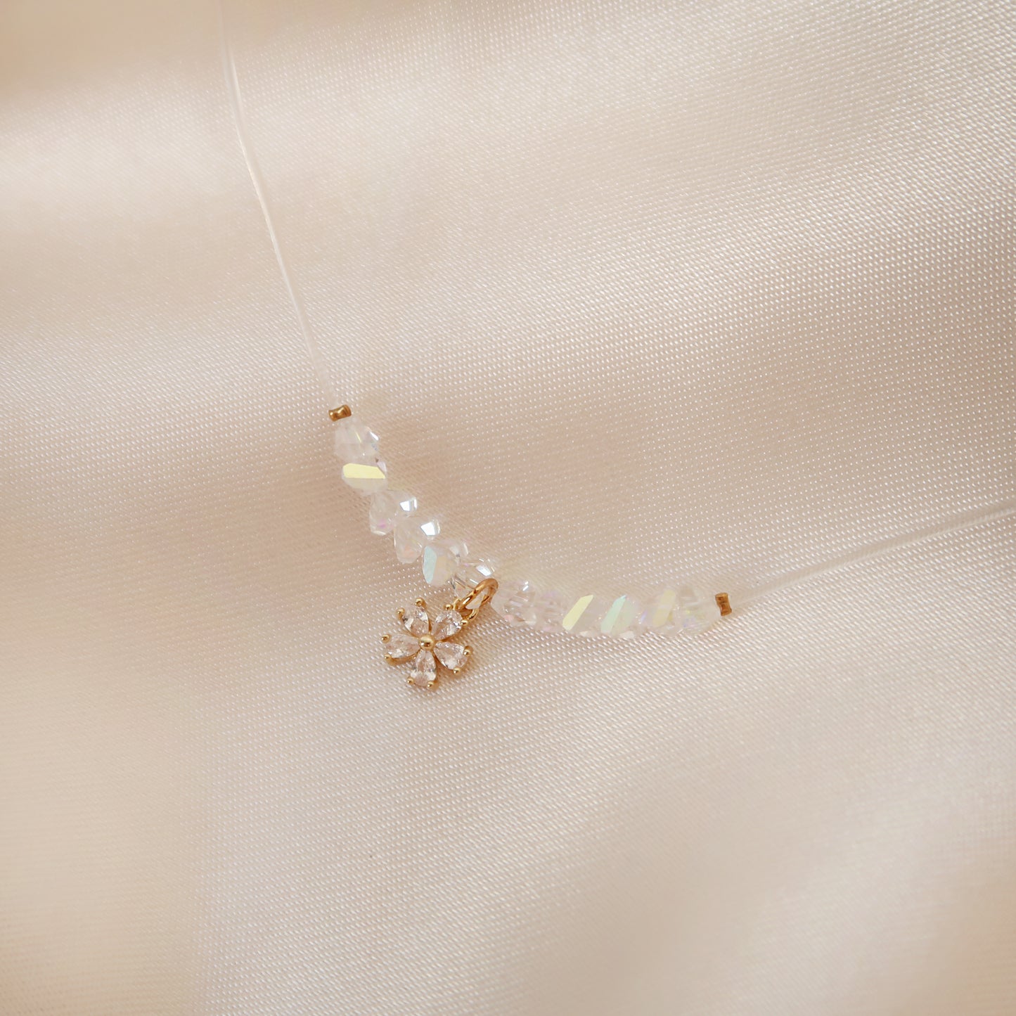 Flowers necklace on transparent cord